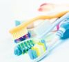 Heap of different multicolored toothbrushes isolated
